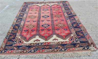 Lot 1484 - Persian carpet with geometric decoration on red and blue ground