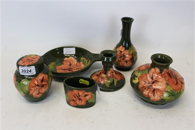 Lot 2024 - Moorcroft Hibiscus pattern small jar and cover with impressed mark to base together with five other similar Moorcroft items (6)
