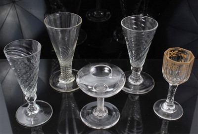 Lot 86 - Three Georgian wrythen ale flutes, a gilt decorated liqueur glass and a lace makers' lamp (5)