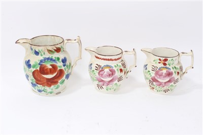 Lot 134 - Three graduated 19th century pottery jugs