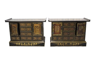 Lot 1408 - Pair of Chinese lacquered cabinets with altar top, drawers and cupboards with carved panels and gilt Chinese figural ornaments, 79cm wide.