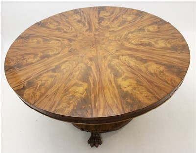 Lot 1415 - William IV mahogany dining table, circular tilt top on faceted bulbous lotus carved column and circular base on paw feet, 138cm diameter