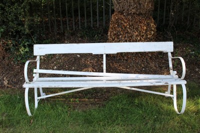 Lot 1418 - Antique white painted garden bench, slat back and seat on scrolled wrought iron frame, 180cm wide