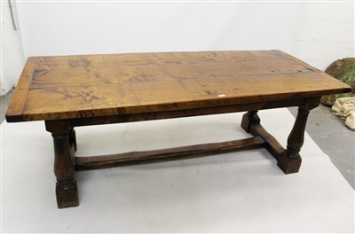 Lot 1423 - 17th century-style brown oak refectory table, plank top with cleated ends raised on baluster turned legs and H-shaped foot stretcher, 214 x 92cm