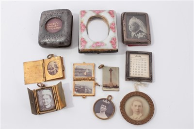 Lot 2757 - Victorian silver miniature photo frame, with image of queen Victoria, 3.5cm high, together with brass miniature folding photo frame, miniature calendar, similar items