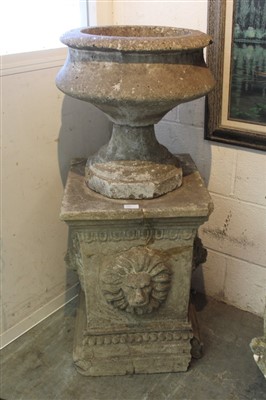 Lot 877 - Antique carved stone urn, on squat form on stepped octagonal foot, raised on square plinth with projecting lion masks, total height 101cm