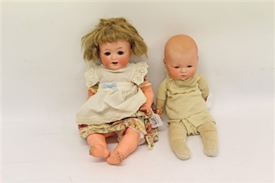 Lot 2775 - Doll- bisque head Heubach Koppelsdorf 342.3 with brown sleeping eyes, painted features, composite body and limbs, together with an Armand Marseille dream baby (2)