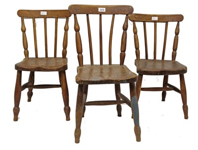 Lot 1023 - Set of five early 20th century elm and beech child’s chairs, each with stick backs and solid seat on turned legs