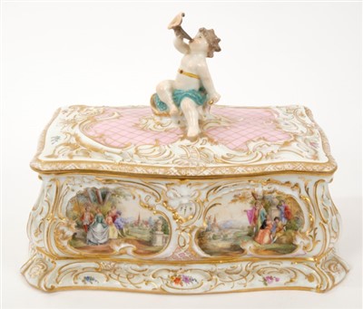 Lot 51 - Continental porcelain box and cover with putto surmount