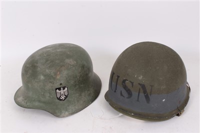 Lot 584 - Film interest - Replica (plastic) Second World War American M1 helmet, with US Navy marking, believed to be ex. Saving Private Ryan prop, together with a replica Nazi M40 Pattern helmet, believed t...