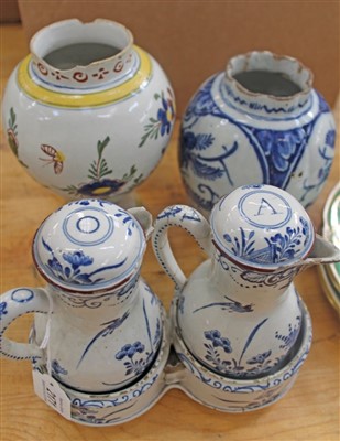 Lot 2171 - 18th century Dutch Delft polychrome vase with floral decoration, 19cm, Delft blue and white fluted vase with floral decoration, 17cm and rare Delft pair blue and white oil and vinegar bottles and c...