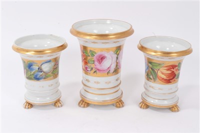 Lot 79 - Garniture of three early 19th Century vases of flared cylindrical form with polychrome painted floral band including pink roses on gilt ground, raised on paw feet comprising central vase 14cm high...