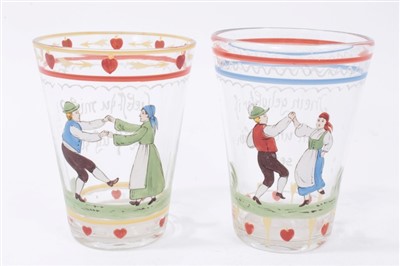 Lot 78 - Two antique European glass tumblers with enamelled decoration and sentiments, 20cmm and 20.5cm
