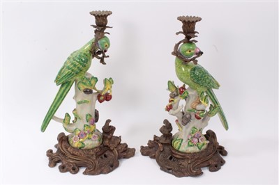 Lot 17 - Pair of 19th century-style parrot candlesticks with gilt metal mounts