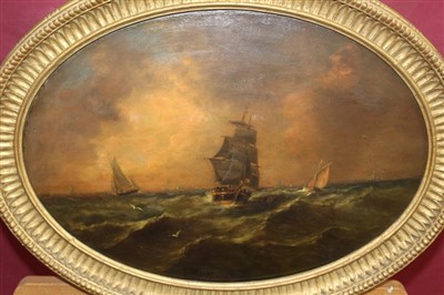 Lot 1048 - John Moore of Ipswich oval oil on panel - shipping at dusk, signed, in oval gilt frame, 32cm x 45cm