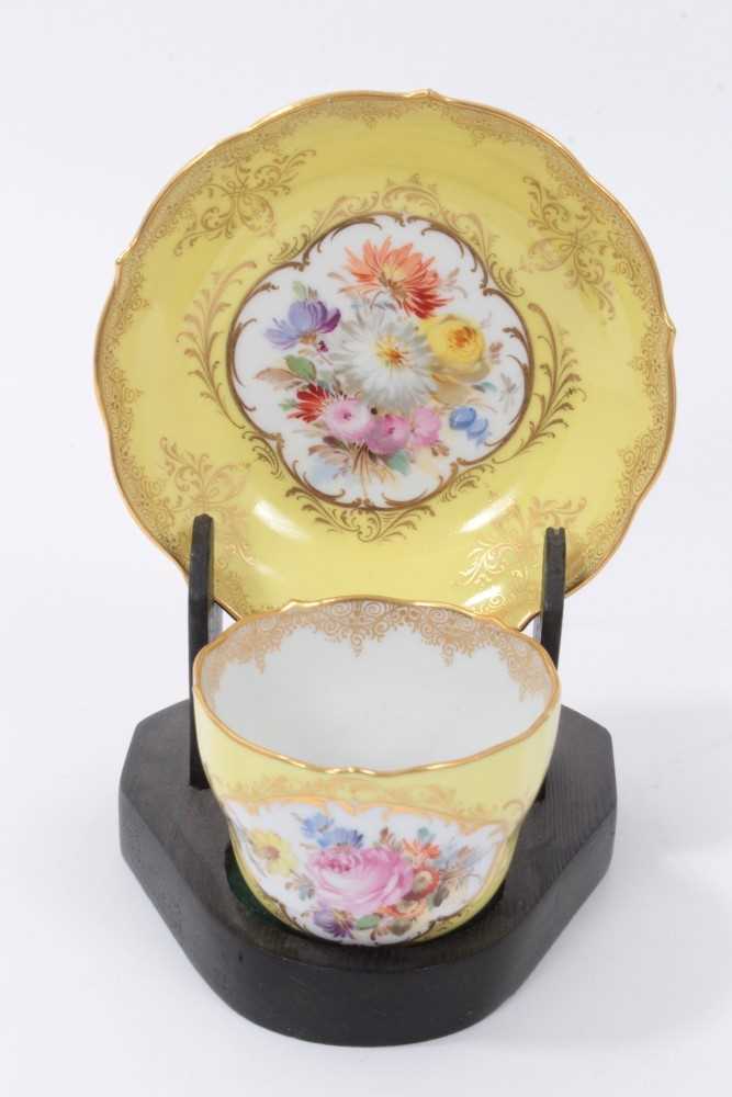Lot 28 - Meissen tea cup and saucer with floral decoration on yellow ground