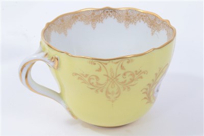 Lot 28 - Meissen tea cup and saucer with floral decoration on yellow ground