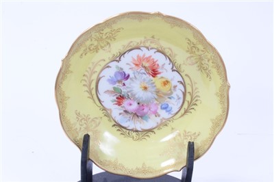 Lot 28 - Meissen tea cup and saucer with floral decoration on yellow ground