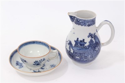 Lot 124 - 18th Century Chinese Export Porcelain Blue and White Sparrow Beak Jug of baluster form, together with a similar tea cup and saucer (3)