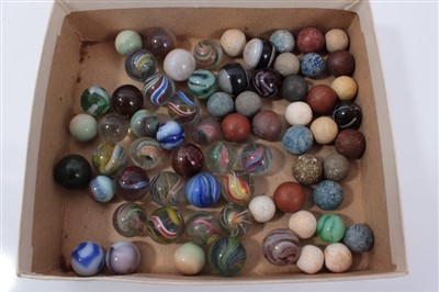 Lot 16 - Good collection of Victorian glass and stone marbles, including approximately fifteen polychrome helix and swirl examples, the largest 17mm diameter