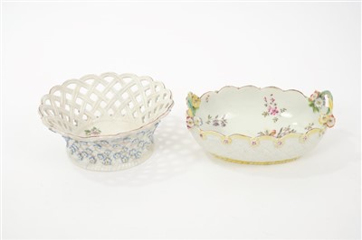 Lot 42 - 18th century Chelsea Derby basket with polychrome painted bird and floral spray decoration ,floral boss and moulded basket weave decorated exterior 18cm and another nut basket with pierced ,floral...