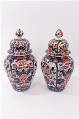 Lot 101 - Pair of Japanese Imari ovoid vases and domed covers