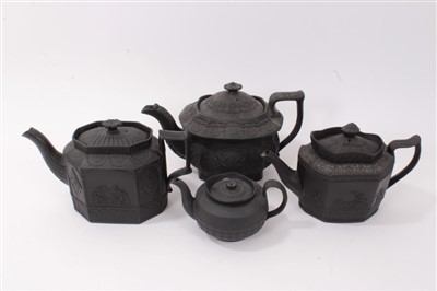 Lot 121 - Four early 19th century black basalt teapots including gothic architectural designs (4)