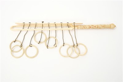 Lot 15 - Rare 19th century Chinese Canton carved ivory Chinese ring puzzle game, with eight suspended rings (one lacking) and carved handle, 23cm long