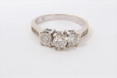 Lot 3306 - White gold 18ct diamond three stone ring with diamond set shoulders