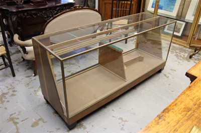 Lot 879 - Glass fronted shops display cabinet, rectangular outline with metal finish, 184cm wide x 62cm deep x 187cm high