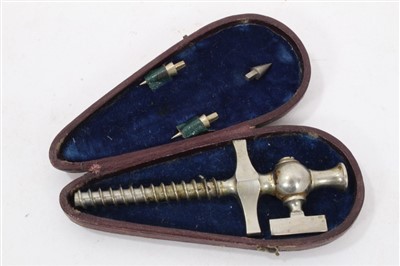 Lot 899 - Early 20th century white metal champagne tap, in leather covered case