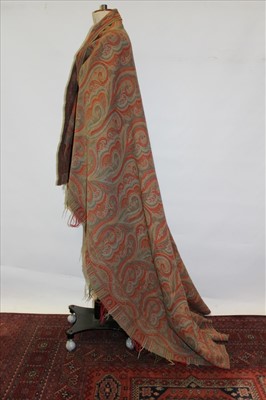 Lot 3057 - Victorian woven wool Paisley shawl with all-over design in red and green.