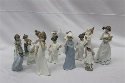 Lot 2091 - Fourteen NAO porcelain figures including girl with lamb, girl with hand mirror and girl with flowers