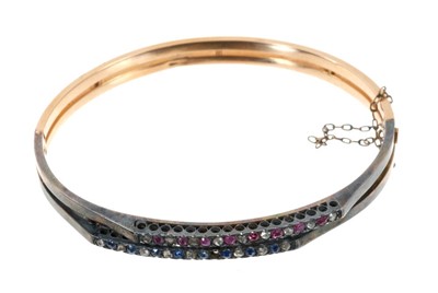 Lot 633 - Late Victorian diamond, ruby and sapphire hinged bangle