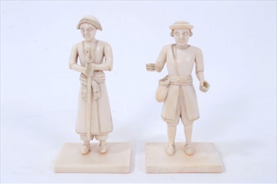Lot 1242 - Rare pair of Indo-Portuguese carved ivory figures, probably 18th century, on square plinths, 8cm high