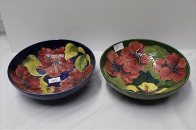 Lot 44 - Moorcroft pottery bowl decorated in the Hibiscus pattern on blue ground and one other