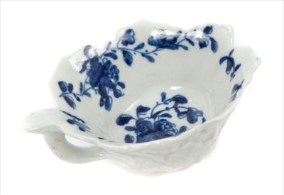 Lot 12 - 18th century Worcester butter boat, leaf-moulded, with twig handle, painted in underglaze blue with the Mansfield pattern, circa 1760, 8.5cm across