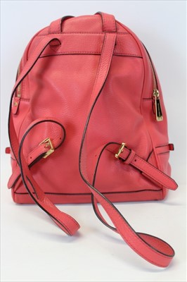 Lot 3112 - Michael Kors Pink leather back pack with engraved zipper pulls and circular logo lining.
