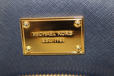 Lot 3113 - Michael Kors Dark Blue Saffiano leather Backpack with engraved zippers and circular logo lining.