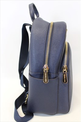 Lot 3113 - Michael Kors Dark Blue Saffiano leather Backpack with engraved zippers and circular logo lining.