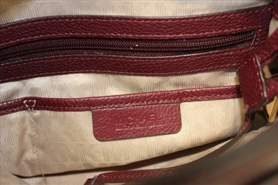 Lot 3114 - Michael Kors mulberry leather handbag with logo padlock to front. Engraved zipper pull and MK logo lining. Plus Michael Kors soft dust bag.