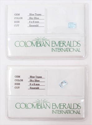 Lot 3286 - Two unmounted blue topaz emerald cut stones