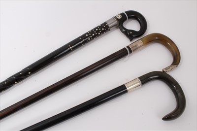Lot 3670 - Late Victorian Rosewood walking stick with silver collar (Birmingham 1899) horn crook handle and silver cap, another continental stick with Ebony shaft, silver collar (stamped 800) and horn handle,...
