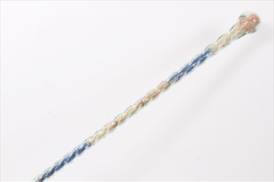 Lot 3663 - Tall late 19th/early 20th century hollow twisted glass walking stick filled with original bands of red, white and blue comfits (hundred and thousands) now faded, 125cm overall length