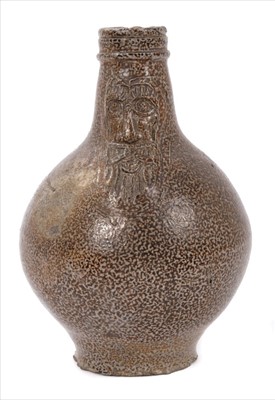 Lot 38 - Unusual small-sized 17th century Rhenish stoneware Bellarmine bottle with string collar