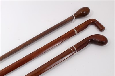 Lot 3697 - Three unusual early 20th century walking sticks made form aeroplane propellers with carved handles and chamfered edges 88cm to 90cm overall length