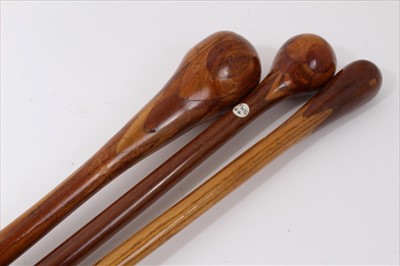 Lot 3701 - Three marquetry topped walking sticks of intricate design incorporating different woods, varying lengths
