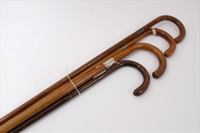 Lot 3709 - Victorian Malacca waling stick with crook handle and silver collar (Birmingham 1894) together with another similar cane stick (London 1929), one other with white metal collar and a plain Partridge ...