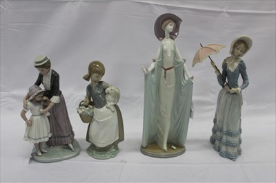 Lot 2192 - Four Lladro figures, including a lady with parasol, a lady in a long dress, mother and child, and a young shepherdess
