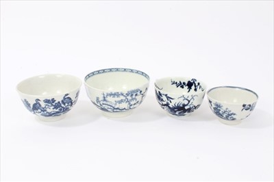 Lot 20 - Four 18th century Worcester blue and white tea bowls, to include one with Cannonball pattern, one with Birds in Branch pattern, one with Prunus Root pattern, and the other with birds flying over an...